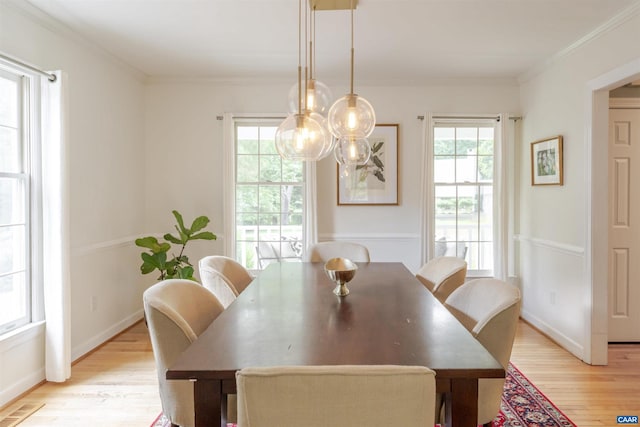 325 Heron Ln, Charlottesville, VA 22903 - dining room with light wood-style flooring, plenty of natural light, and crown molding