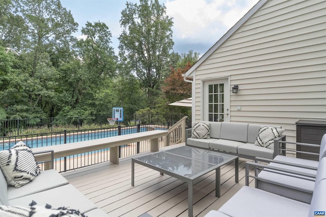 325 Heron Ln, Charlottesville, VA 22903 - wooden deck with outdoor lounge area and view of wooded area
