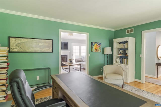325 Heron Ln, Charlottesville, VA 22903 - office area with wood finished floors, crown molding, and a fireplace