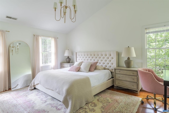 325 Heron Ln, Charlottesville, VA 22903 - bedroom with vaulted ceiling, a chandelier, and wood finished floors