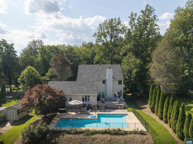325 Heron Ln, Charlottesville, VA 22903 - view of swimming pool featuring a deck, an outdoor living space, a patio area, and a shed