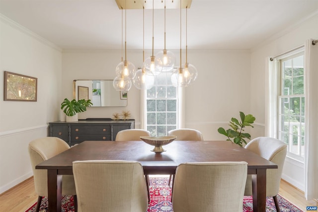 325 Heron Ln, Charlottesville, VA 22903 - dining area with light wood-style floors and ornamental molding