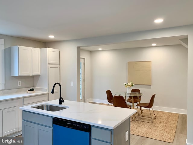 840 Columbia Ave, Cumberland, MD 21502 - kitchen with dishwasher, recessed lighting, light wood-type flooring, white cabinetry, and an island with sink