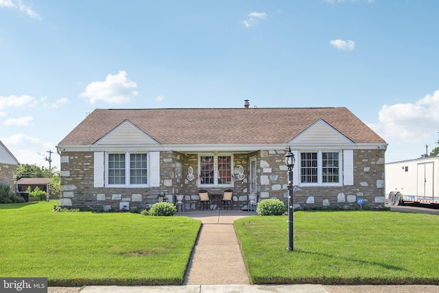 9959 Ferndale St, Philadelphia, PA 19115 - view of front facade with a front lawn, roof with shingles, and stone siding