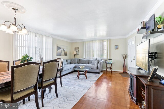 9959 Ferndale St, Philadelphia, PA 19115 - living area with healthy amount of natural light, ornamental molding, and a chandelier
