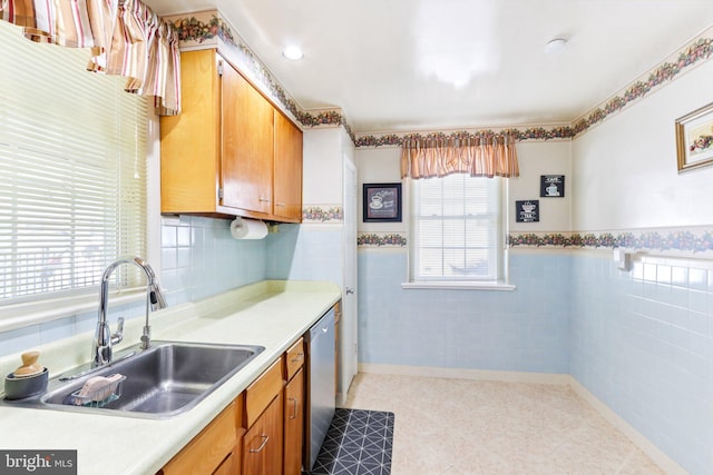 9959 Ferndale St, Philadelphia, PA 19115 - kitchen with dishwasher, light countertops, a wainscoted wall, tile walls, and brown cabinets
