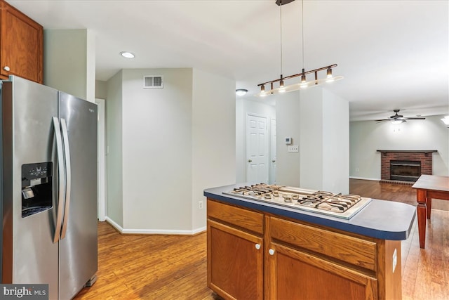 9409 Emory Grove Rd, Gaithersburg, MD 20877 - kitchen with stainless steel refrigerator with ice dispenser, gas cooktop, dark countertops, ceiling fan, and recessed lighting