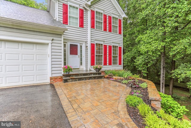 9409 Emory Grove Rd, Gaithersburg, MD 20877 - view of front of property with asphalt driveway, a garage, and roof with shingles
