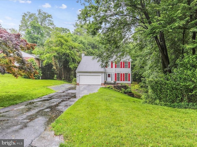 9409 Emory Grove Rd, Gaithersburg, MD 20877 - view of front facade with asphalt driveway, a front lawn, a garage, and a chimney