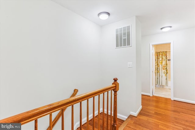 9409 Emory Grove Rd, Gaithersburg, MD 20877 - corridor with an upstairs landing and light wood-style floors