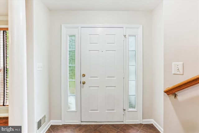 9409 Emory Grove Rd, Gaithersburg, MD 20877 - entrance foyer featuring dark tile patterned floors and baseboards