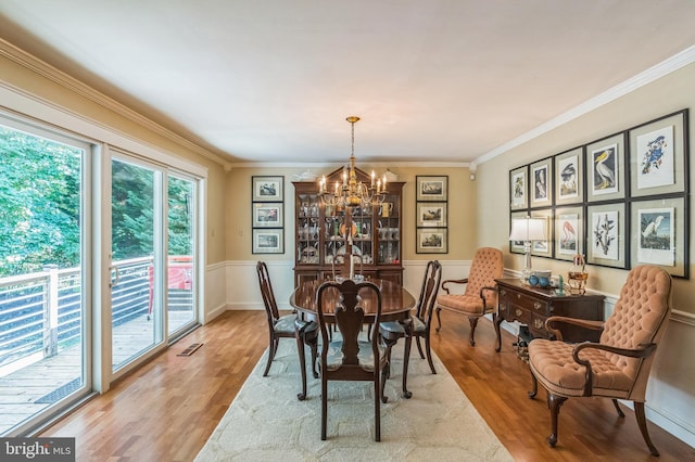 238 Winding Way Rd, Stratford, NJ 08084 - dining area featuring wood finished floors, a chandelier, crown molding, and wainscoting