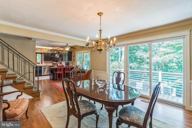 238 Winding Way Rd, Stratford, NJ 08084 - dining room featuring a chandelier, wood finished floors, ornamental molding, and stairway