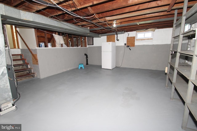 804 N Augustine St, Wilmington, DE 19804 - below grade area with freestanding refrigerator, electric panel, and stairway