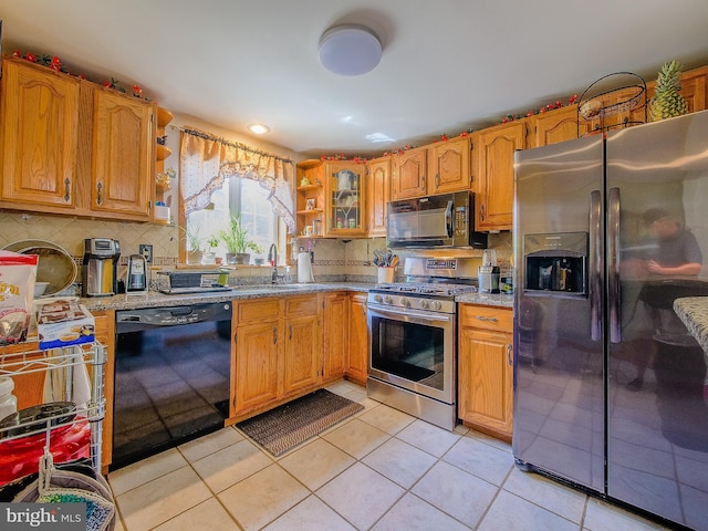 616 Glenfield Ave, Glenolden, PA 19036 - kitchen with black appliances, open shelves, decorative backsplash, and light tile patterned floors