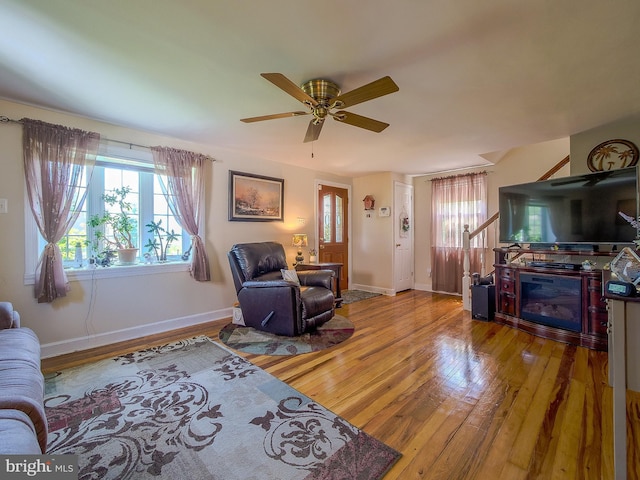 616 Glenfield Ave, Glenolden, PA 19036 - living room with wood-type flooring, plenty of natural light, a ceiling fan, and a fireplace