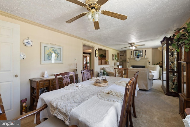 381 Youngs Dr, Front Royal, VA 22630 - dining area with a ceiling fan, carpet flooring, a textured ceiling, a fireplace, and ornamental molding