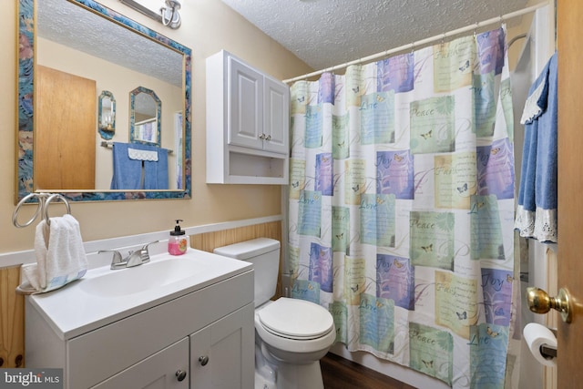 381 Youngs Dr, Front Royal, VA 22630 - full bath with a textured ceiling, vanity, wainscoting, and curtained shower