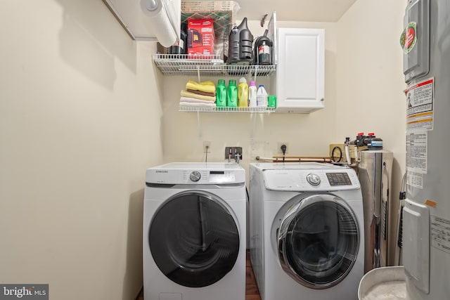 2 Evans Ln, Ruther Glen, VA 22546 - laundry room with water heater, cabinet space, and washer and clothes dryer