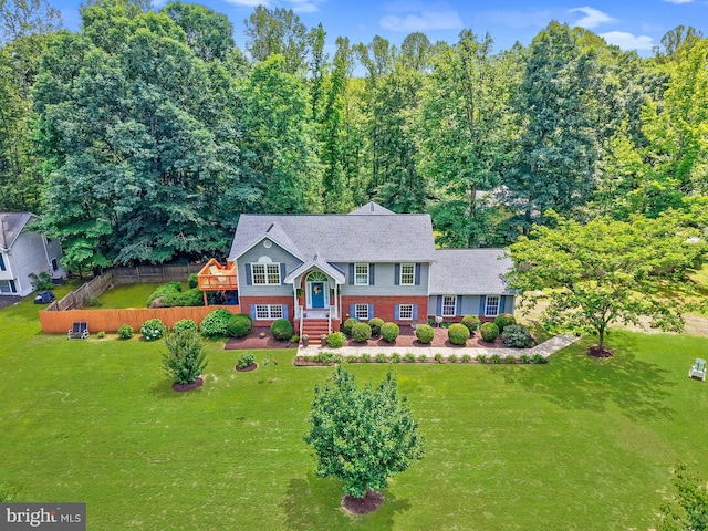 2 Evans Ln, Ruther Glen, VA 22546 - view of front of home featuring a front yard and brick siding