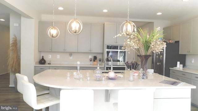 12507 Olivine Ct, Hagerstown, MD 21740 - kitchen featuring appliances with stainless steel finishes, light countertops, a chandelier, recessed lighting, and pendant lighting