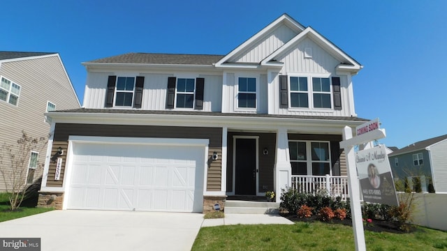 12507 Olivine Ct, Hagerstown, MD 21740 - craftsman-style house with board and batten siding, a porch, concrete driveway, and an attached garage