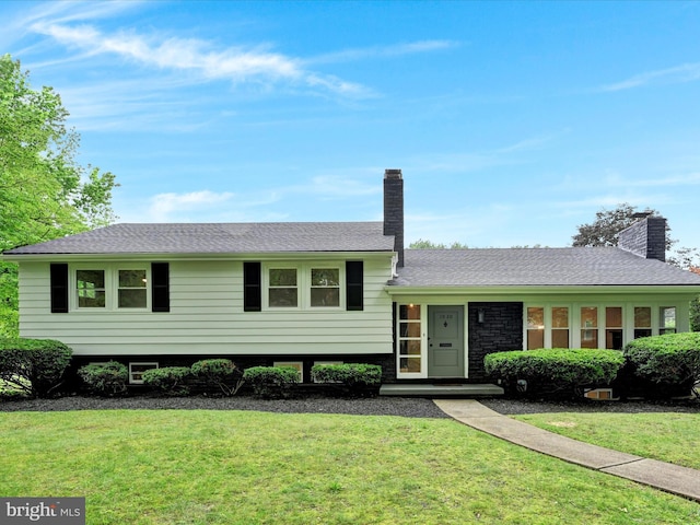 1020 Wyomissing Blvd, Wyomissing, PA 19610 - split level home featuring a front lawn and a chimney
