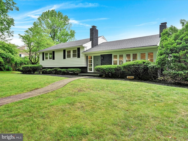 1020 Wyomissing Blvd, Wyomissing, PA 19610 - split level home featuring a chimney and a front lawn