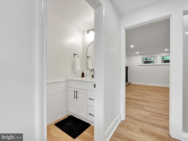 1020 Wyomissing Blvd, Wyomissing, PA 19610 - bathroom with vanity, wood finished floors, and a brick fireplace