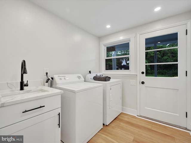 1020 Wyomissing Blvd, Wyomissing, PA 19610 - laundry room featuring independent washer and dryer, plenty of natural light, light wood-style floors, cabinet space, and recessed lighting