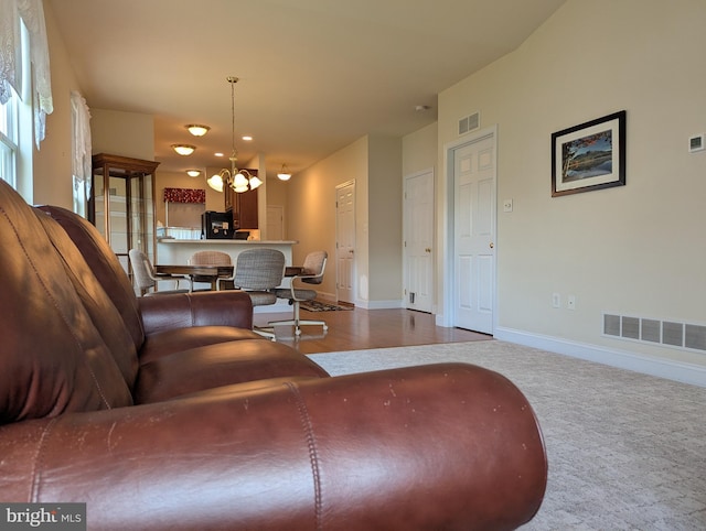 43 Helene Ct, Hamburg, PA 19526 - carpeted living area featuring a chandelier and baseboards