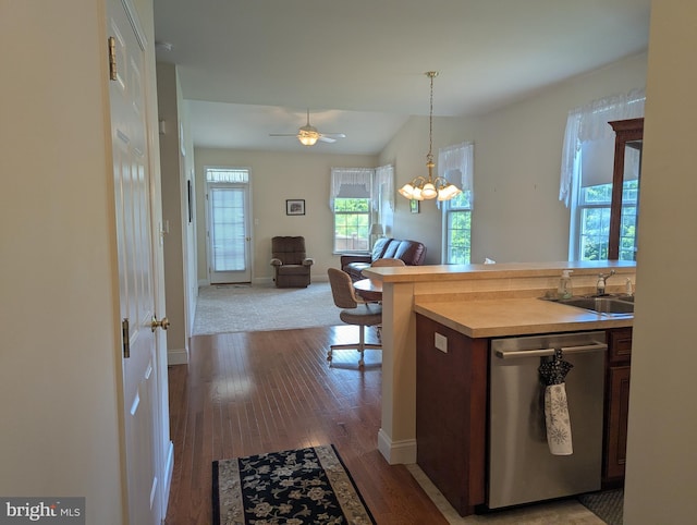 43 Helene Ct, Hamburg, PA 19526 - kitchen with stainless steel dishwasher, wood finished floors, open floor plan, light countertops, and decorative light fixtures