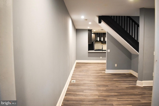 607 N Broom St, Wilmington, DE 19805 - corridor with recessed lighting, wood finished floors, and stairs
