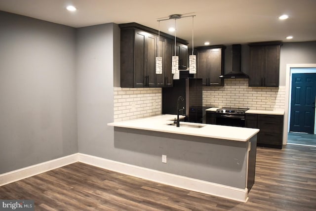 607 N Broom St, Wilmington, DE 19805 - kitchen with wall chimney range hood, stainless steel electric range, decorative backsplash, light countertops, and recessed lighting