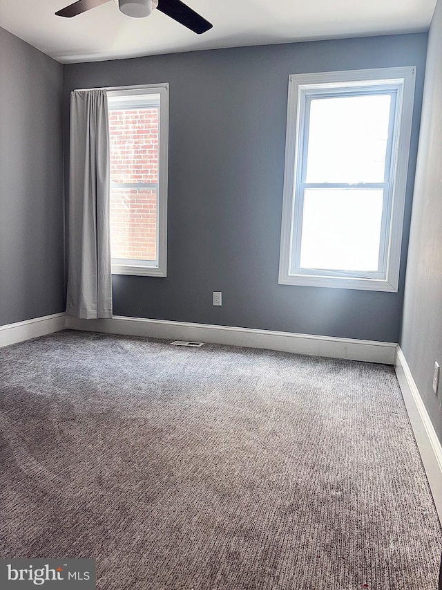 607 N Broom St, Wilmington, DE 19805 - carpeted empty room with ceiling fan and baseboards