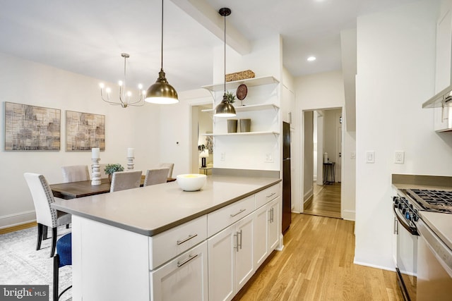 3105 17th St NW, Washington, DC 20010 - kitchen featuring gas stove, light wood-style flooring, open shelves, white cabinetry, and a chandelier