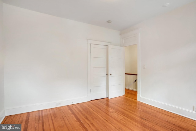 3105 17th St NW, Washington, DC 20010 - empty room featuring light wood-type flooring and a smoke detector