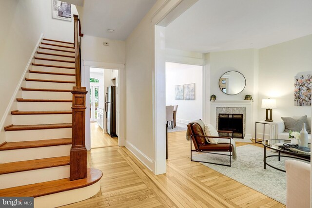3105 17th St NW, Washington, DC 20010 - staircase with wood finished floors and a fireplace