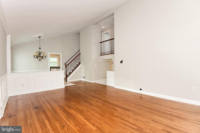 15 Constance Dr, Hamilton, NJ 08620 - spare room featuring a chandelier, wood finished floors, stairway, and lofted ceiling