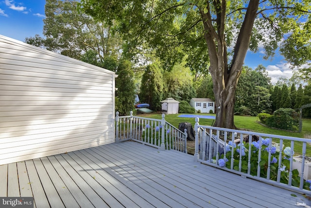 15 Constance Dr, Hamilton, NJ 08620 - wooden deck with a storage shed, a yard, and view of wooded area