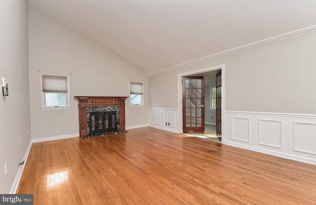15 Constance Dr, Hamilton, NJ 08620 - unfurnished living room with light wood finished floors, a high end fireplace, crown molding, wainscoting, and lofted ceiling