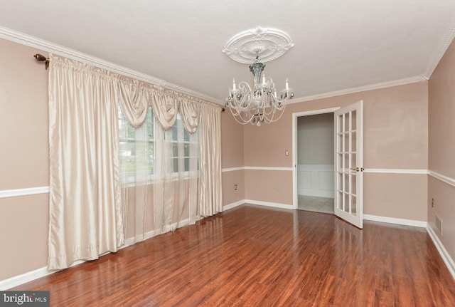 15 Constance Dr, Hamilton, NJ 08620 - empty room featuring a chandelier, wood finished floors, ornamental molding, and french doors