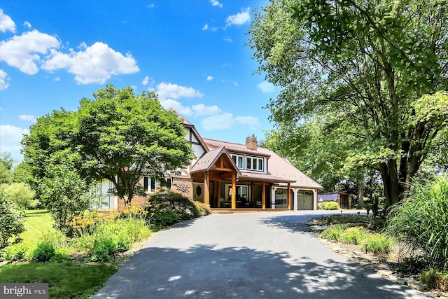 615 Beinhower Rd, Etters, PA 17319 - view of front facade with a porch, curved driveway, and a chimney