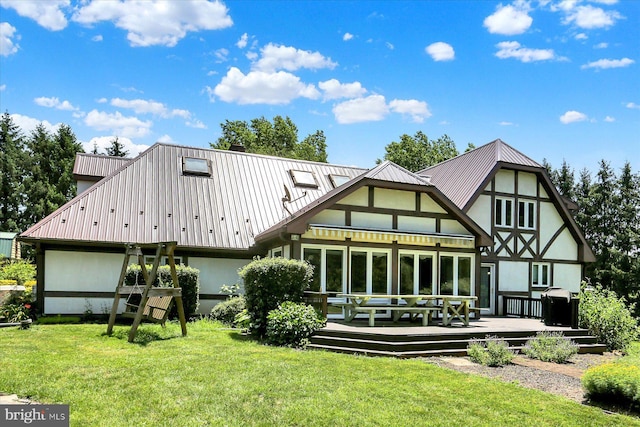 615 Beinhower Rd, Etters, PA 17319 - back of house featuring a yard, a wooden deck, a metal roof, and stucco siding