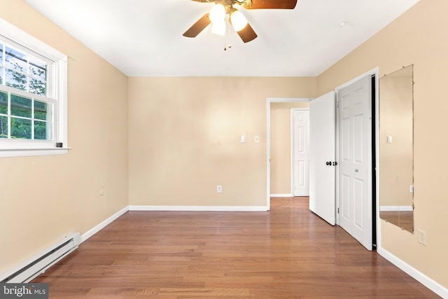 643 Comly Ave, Langhorne, PA 19047 - unfurnished bedroom featuring a baseboard heating unit, light wood-style floors, and a ceiling fan