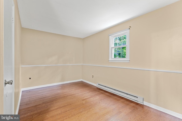 643 Comly Ave, Langhorne, PA 19047 - unfurnished room featuring baseboard heating and wood finished floors