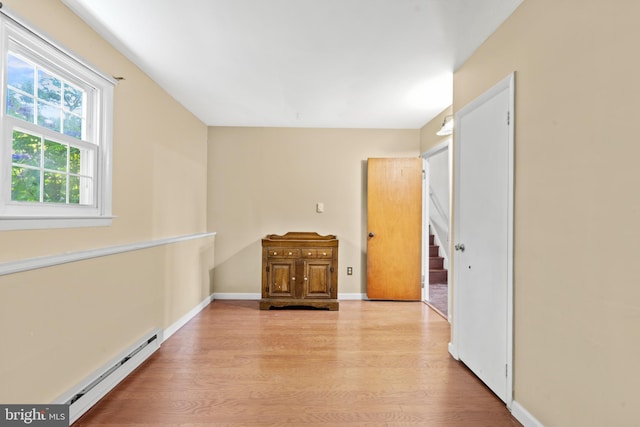 643 Comly Ave, Langhorne, PA 19047 - empty room with baseboard heating and wood finished floors