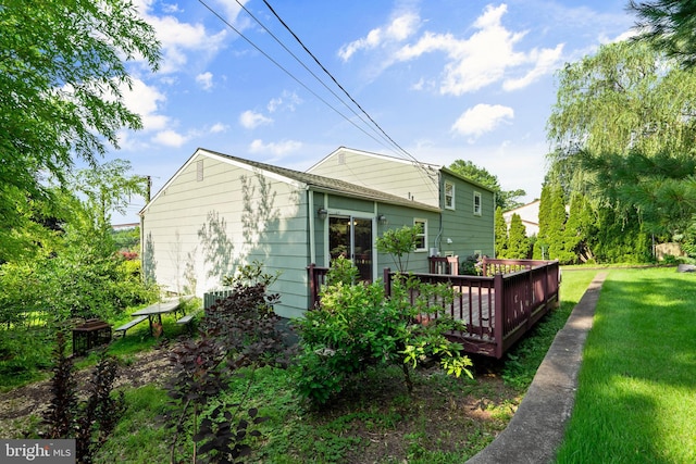 643 Comly Ave, Langhorne, PA 19047 - rear view of property featuring a wooden deck and a lawn