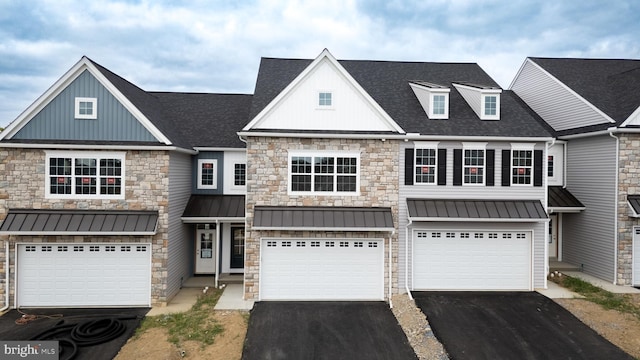0 Spring Water Cir, Lancaster, PA 17601 - view of property with driveway, board and batten siding, a garage, stone siding, and a standing seam roof