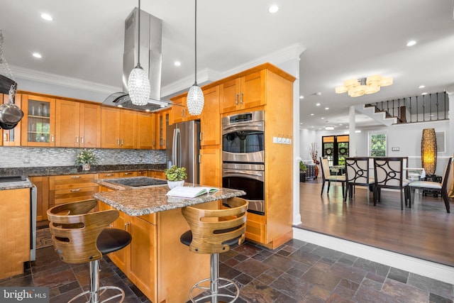 1125 K St NE, Washington, DC 20002 - kitchen with appliances with stainless steel finishes, island exhaust hood, ornamental molding, a center island, and brown cabinetry